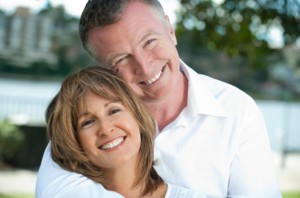 Mature couple laughing together in the park